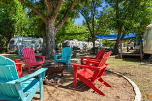 a group of colorful chairs around a fire pit at The Powell